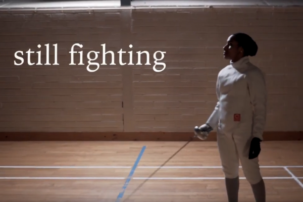 This image shows a person with an eating disorder in a fencing outfit which represents their fight against mental health stigma.