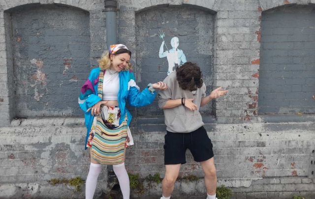 Rocking Out: Photo of a teenage boy and girl laughing and playing air guitar. Runner-up in Frame of Mind photography competition.
